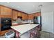 Spacious kitchen features a large island, stainless steel appliances, stone backsplash, and recessed lighting at 16753 W Bristol Ln, Surprise, AZ 85374