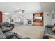 Comfortable living room featuring fireplace and media storage at 16753 W Bristol Ln, Surprise, AZ 85374