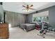 Comfortable main bedroom with view of palm trees at 16753 W Bristol Ln, Surprise, AZ 85374