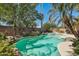 Backyard pool area surrounded by lush landscaping provides a private and relaxing outdoor oasis at 16753 W Bristol Ln, Surprise, AZ 85374