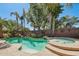 Backyard pool and spa with mature landscaping creating a private oasis at 16753 W Bristol Ln, Surprise, AZ 85374