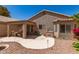 Spacious backyard featuring a covered patio and easy-care desert landscaping at 17119 N Joshua Path, Surprise, AZ 85374