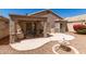 Charming outdoor living space with patio, fountain, and desert landscaping at 17119 N Joshua Path, Surprise, AZ 85374