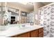 Cozy bathroom featuring shower and white flowered decor at 17119 N Joshua Path, Surprise, AZ 85374