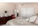 Comfortable bedroom with a queen-sized bed and large dresser at 17119 N Joshua Path, Surprise, AZ 85374