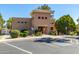 Charming single-story community clubhouse with a desert landscape and designated parking at 17119 N Joshua Path, Surprise, AZ 85374
