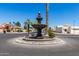 Community water feature and roundabout adds charm to this neighborhood at 17119 N Joshua Path, Surprise, AZ 85374