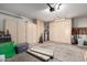 Spacious garage featuring ample storage cabinets and a water heater at 17119 N Joshua Path, Surprise, AZ 85374