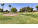 Well-kept golf course featuring a sand trap, pond, and lush green grass at 17119 N Joshua Path, Surprise, AZ 85374