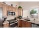 Well-appointed kitchen with stainless steel appliances and granite countertops at 17119 N Joshua Path, Surprise, AZ 85374