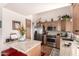 Well-equipped kitchen with granite countertops, stainless steel appliances, and ample cabinet space at 17119 N Joshua Path, Surprise, AZ 85374