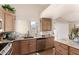 Bright kitchen with generous counter space, stainless dishwasher, and lots of cabinet storage at 17119 N Joshua Path, Surprise, AZ 85374