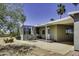 Back patio with patio furniture, sun room, and easy access to the yard and property at 17200 W Bell Rd # 324, Surprise, AZ 85374