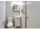 Well lit bathroom features a toilet, vanity, sink, mirror, and storage at 17200 W Bell Rd # 324, Surprise, AZ 85374