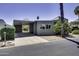 Charming home featuring a covered carport, desert landscaping, and a modern design at 17200 W Bell Rd # 324, Surprise, AZ 85374