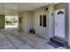 Covered front entrance features a white door, window, and exterior light fixture at 17200 W Bell Rd # 324, Surprise, AZ 85374