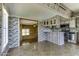 Kitchen with stainless steel appliances, ample counter space and rustic gray washed brick and wood paneled walls at 17200 W Bell Rd # 324, Surprise, AZ 85374