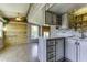 Kitchen with stainless steel appliances, ample counter space and rustic gray washed brick and wood paneled walls at 17200 W Bell Rd # 324, Surprise, AZ 85374