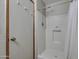 Bright bathroom offers a white shower with shower curtain, soap dish, and door at 17200 W Bell Rd # 324, Surprise, AZ 85374