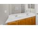 Double sink bathroom vanity with warm wood cabinets and updated hardware at 1754 E Bradstock Way, San Tan Valley, AZ 85140