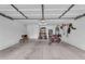 Spacious garage with epoxy flooring and ample space for parking and storage at 1754 E Bradstock Way, San Tan Valley, AZ 85140