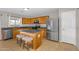 Kitchen with stainless steel appliances, granite countertops, center island, and two breakfast bar stools at 1754 E Bradstock Way, San Tan Valley, AZ 85140