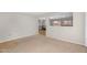 Bright, airy living room with views of the kitchen and backyard at 1754 E Bradstock Way, San Tan Valley, AZ 85140