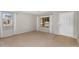Cozy living room featuring multiple windows, natural light and carpeted floor at 1754 E Bradstock Way, San Tan Valley, AZ 85140