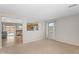 Neutral living room with an open view to the kitchen at 1754 E Bradstock Way, San Tan Valley, AZ 85140