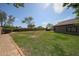 Large backyard with a well-maintained lawn and pathway, ideal for outdoor gatherings and enjoying the Arizona sunshine at 17806 N 54Th Ln, Glendale, AZ 85308