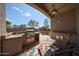 Relaxing covered patio with BBQ island and plenty of seating for entertaining at 17806 N 54Th Ln, Glendale, AZ 85308