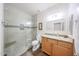 Updated bathroom with a tiled shower and granite countertop vanity at 17806 N 54Th Ln, Glendale, AZ 85308