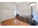Bright bedroom with closet, wood floor, and vaulted ceiling at 17806 N 54Th Ln, Glendale, AZ 85308