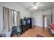 This spare bedroom includes vinyl floors, window, and access to storage at 17806 N 54Th Ln, Glendale, AZ 85308