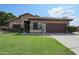 Charming single-story home featuring a well-manicured lawn and a two-car garage at 17806 N 54Th Ln, Glendale, AZ 85308