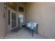 Inviting front porch with welcome decor, bench seating and decorative pillows at 17806 N 54Th Ln, Glendale, AZ 85308