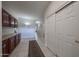 Hallway with modern cabinets and closet space at 17806 N 54Th Ln, Glendale, AZ 85308