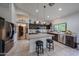Kitchen featuring stainless appliances, center island, and custom cabinets at 17806 N 54Th Ln, Glendale, AZ 85308