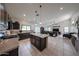 Spacious kitchen with island, dark cabinetry and open to living space at 17806 N 54Th Ln, Glendale, AZ 85308