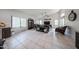 Spacious living room with tile flooring and large windows offering natural light at 17806 N 54Th Ln, Glendale, AZ 85308