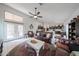 Open-concept living room leading to the kitchen with comfortable seating at 17806 N 54Th Ln, Glendale, AZ 85308