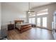 Spacious main bedroom with vaulted ceilings, a ceiling fan, and backyard access through french doors at 17806 N 54Th Ln, Glendale, AZ 85308
