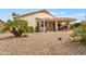 Enjoy the backyard patio with a pergola, desert landscaping, and privacy at 17939 N Encanto Dr, Surprise, AZ 85374