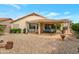 Spacious backyard with covered patio, perfect for outdoor living and entertaining in the fresh air at 17939 N Encanto Dr, Surprise, AZ 85374