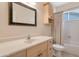 Well-maintained bathroom with an over-the-sink cabinet and shower-tub combination at 17939 N Encanto Dr, Surprise, AZ 85374