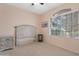 Clean and bright bedroom with large window view and traditional furniture at 17939 N Encanto Dr, Surprise, AZ 85374