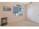 Bedroom with a window view and a closet, providing natural light and storage at 17939 N Encanto Dr, Surprise, AZ 85374