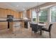 Sun-drenched kitchen features an island and a breakfast nook at 17939 N Encanto Dr, Surprise, AZ 85374