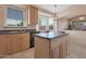 Open kitchen featuring wooden cabinets and stainless steel appliances at 17939 N Encanto Dr, Surprise, AZ 85374