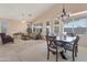 Spacious open concept living room and dining area with large windows at 17939 N Encanto Dr, Surprise, AZ 85374